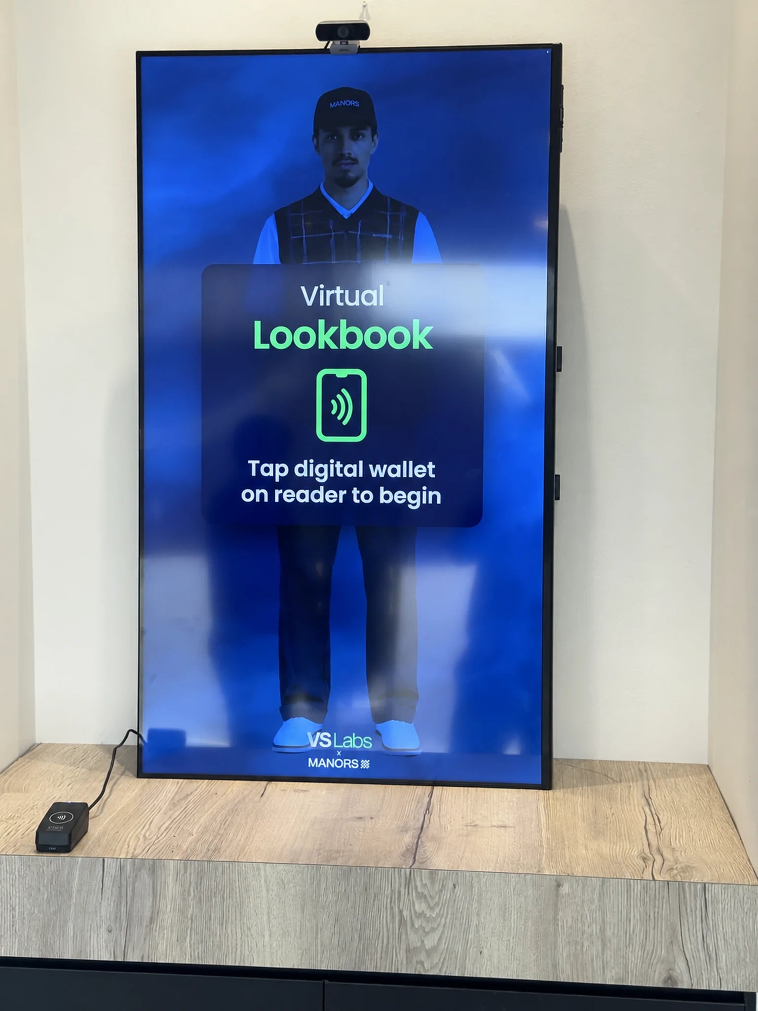 Portrait Magic Mirror display showing the Virtual Lookbook welcome screen